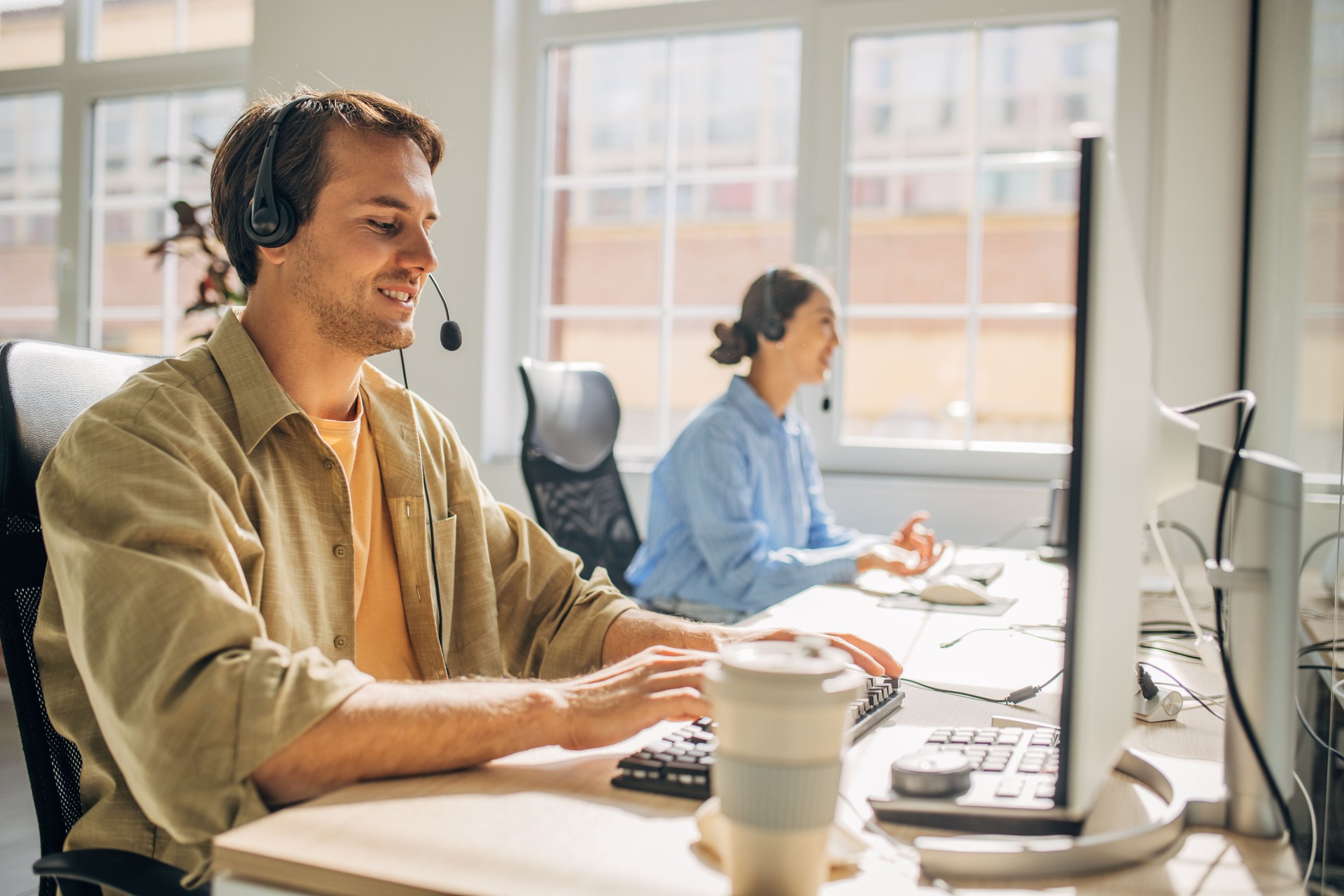 Man at Desk Engaged in Customer Support Conversation